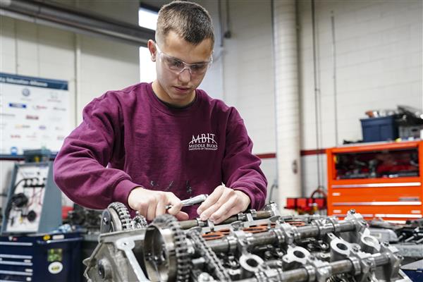 Automotive Technology student working on cars